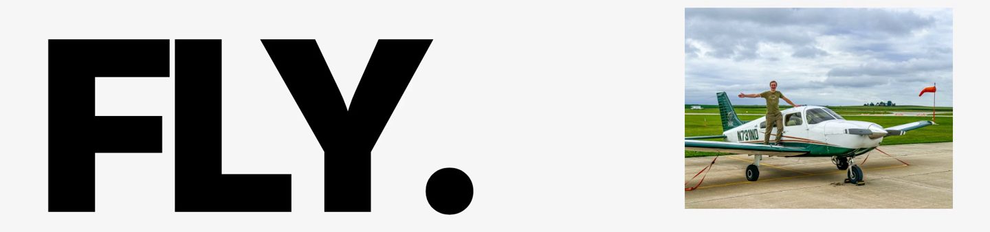 Minimal flight school homepage design with a giant FLY headline