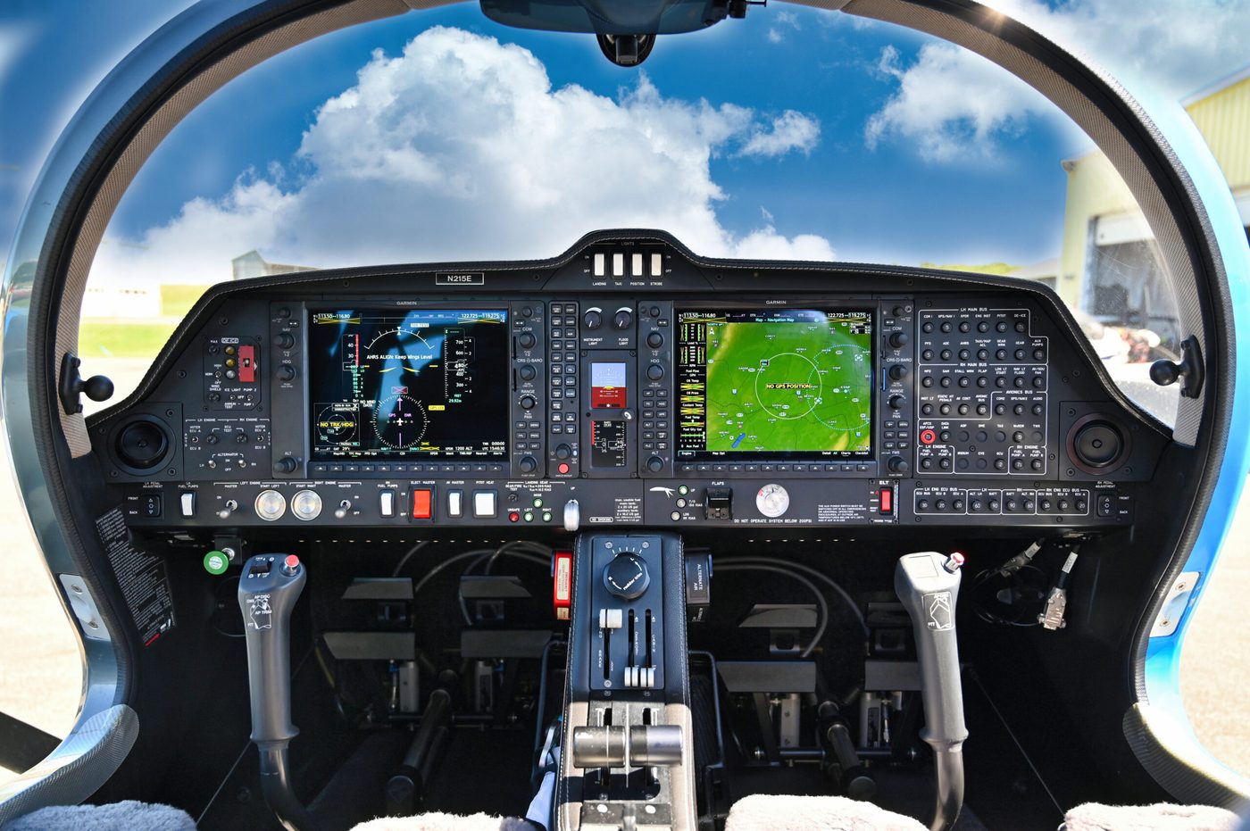 Glass cockpit of a Diamond DA42 with the screens held legible against a bright canopy